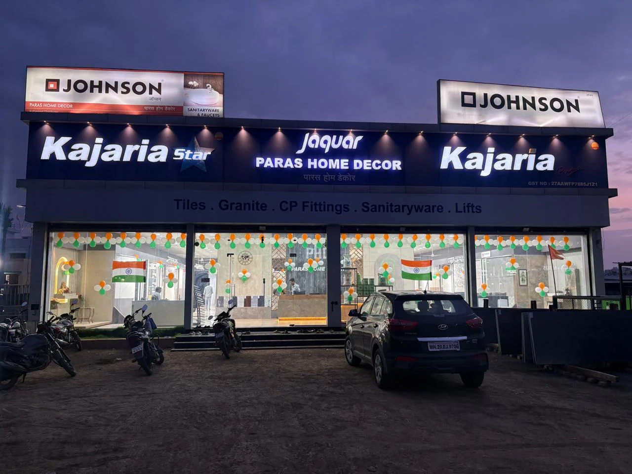 Paras Home Decor showroom on Beed Bypass Road, Chhatrapati Sambhajinagar, lit up at dusk with Kajaria, Johnson and Jaquar signage